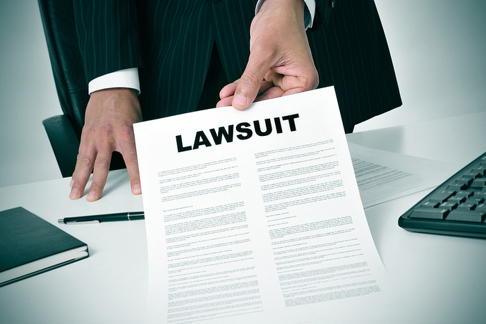 Lawyer Handing Over Lawsuit