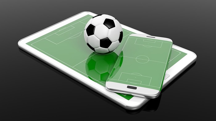 3D Tablet and Smartphone Showing Football Pitches