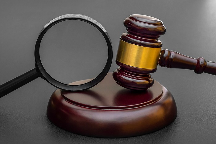 Magnifying Glass with Judges Gavel