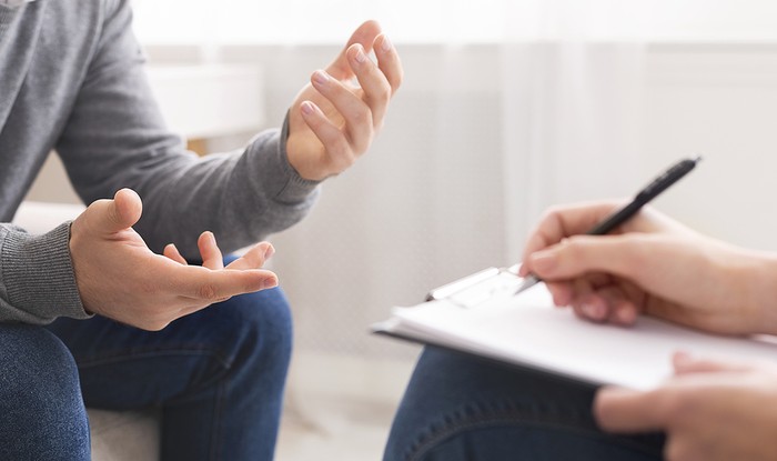 Man Talking to Counsellor