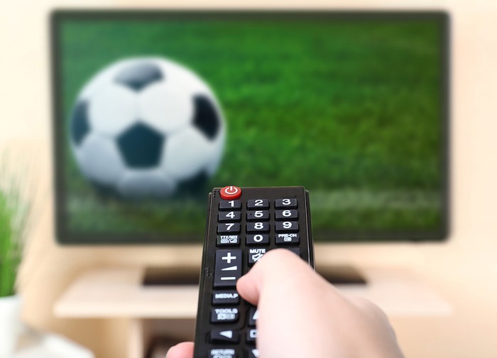 Remote Control Pointing at Football game on TV