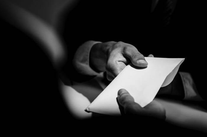 Businessman taking bribe