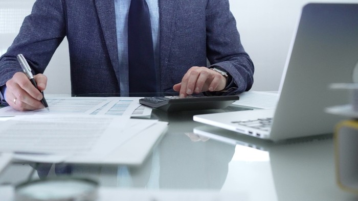 Accountant Completing Paperwork