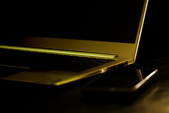 Laptop and Phone Close Up in Dark Room