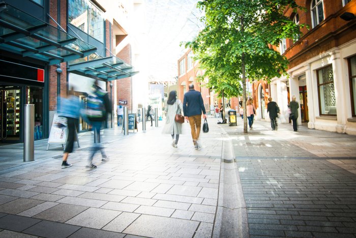 Shopper Walking in Quiet High Street