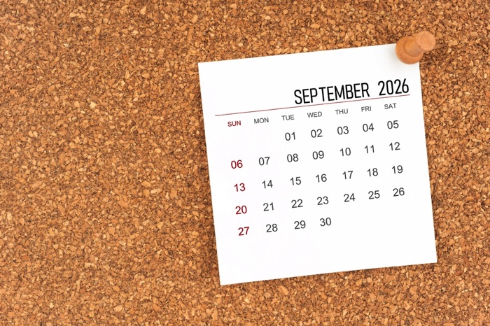 September 2026 calendar page on cork board