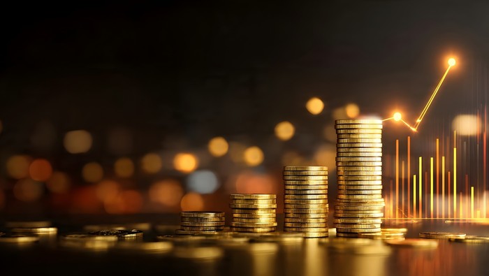Gold Coin Stacks Against Chart