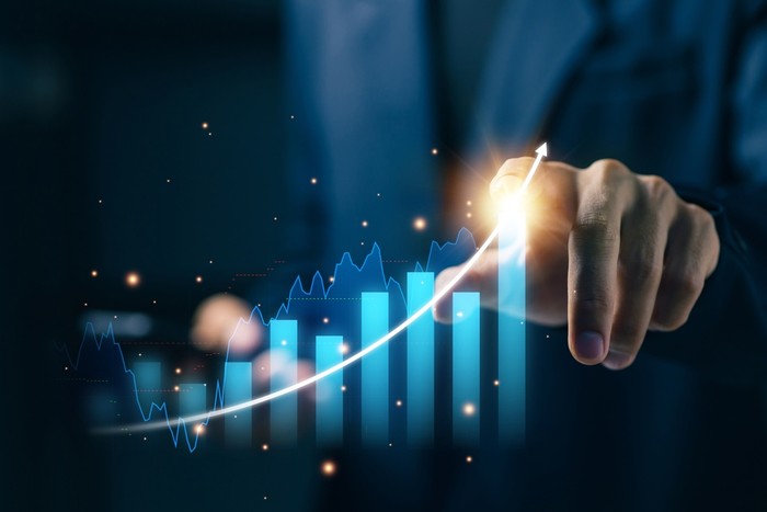 Hand Pointing at Chart Showing Increases