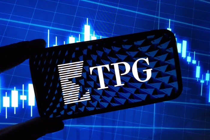 TPG Logo on Phone Screen Against Chart