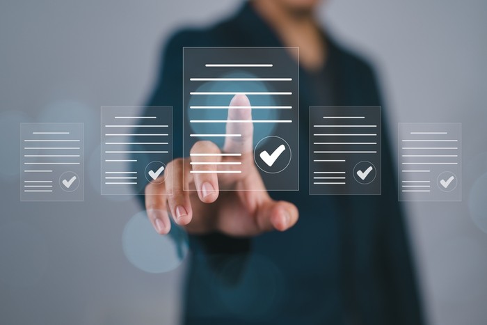 Business Person with Checklist Document Holograms