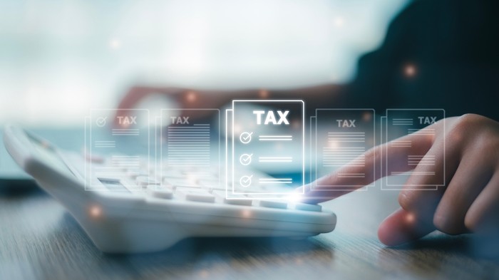 Tax Holograms Against Calculator